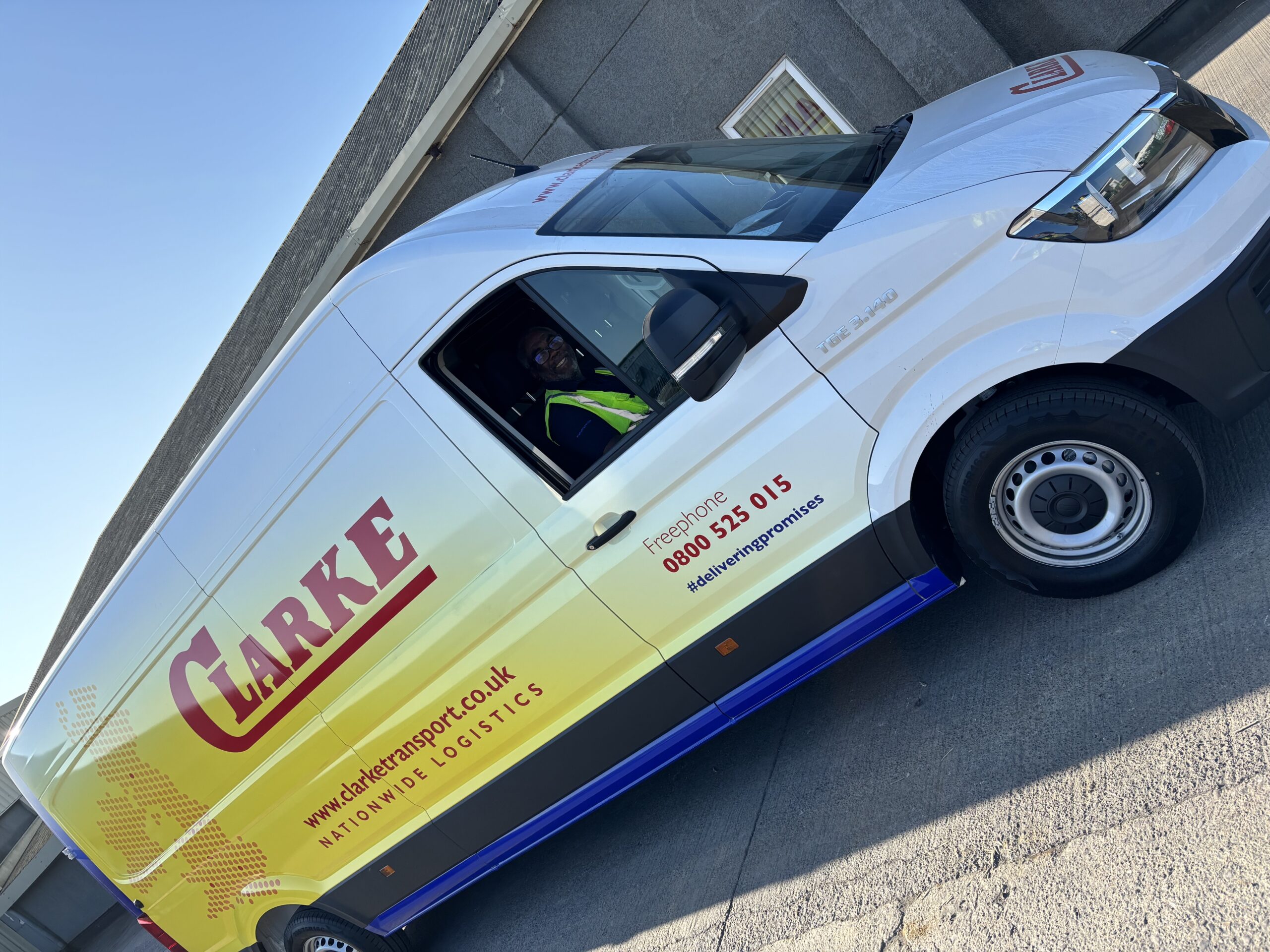 New Clarke Transport Van Hits the Road! 3 Brand new Clarke Transport van parked outside the depot with a driver standing beside it, ready to begin delivery routes across the UK.