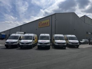 Home 6 Newly upgraded Clarke Transport delivery vans featuring modern design and branding, part of the refreshed UK logistics fleet for improved transport services.