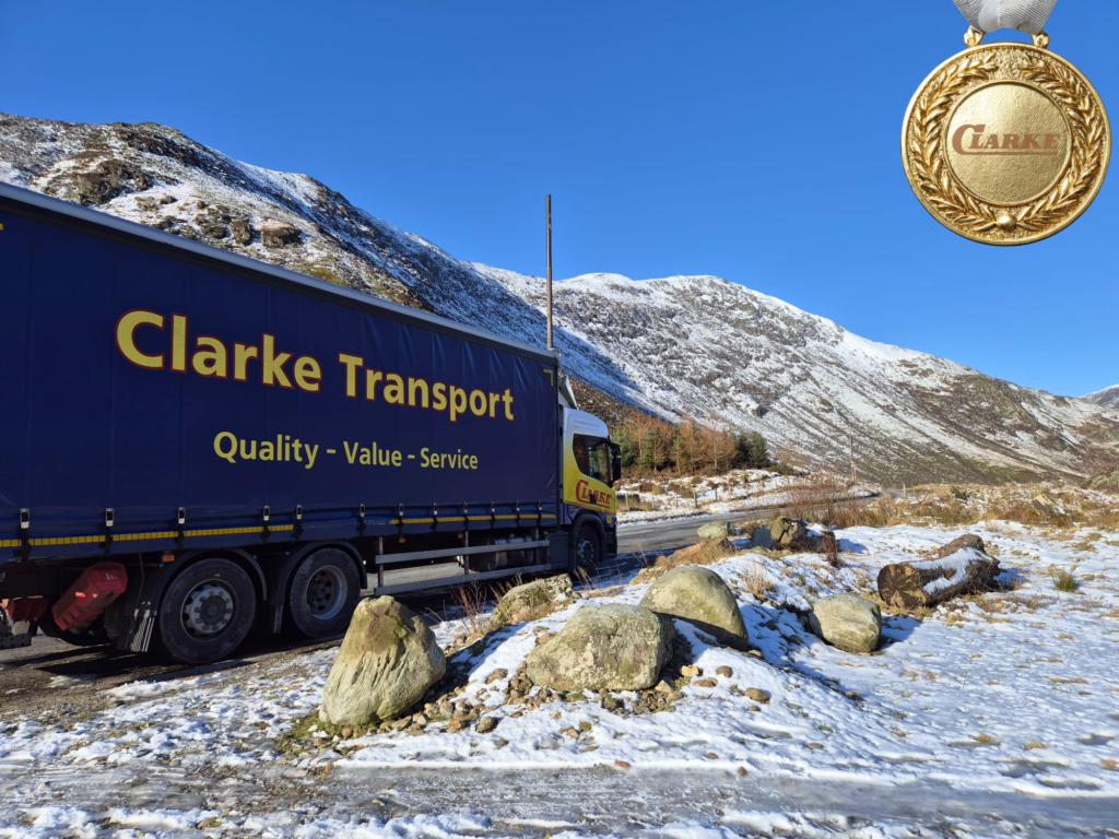 Clarke Transport Photo of the Month – March Winner Announced 1 Clarke Transport Truck parked in snowy mountainous landscape.